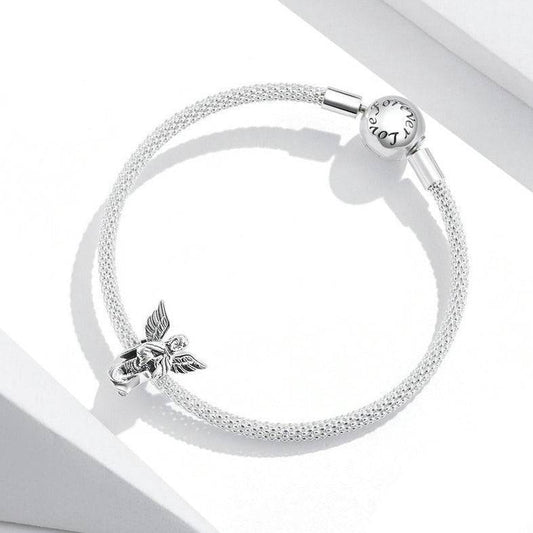 Elegant Angel Charm on silver mesh bracelet, symbolizing peace and protection. Ideal for spiritual jewelry lovers seeking meaningful accessories.