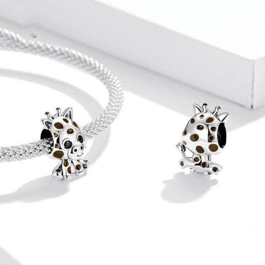 Adorable Baby Giraffe Charm in silver with brown spots, designed for animal lovers. Fits perfectly on charm bracelets or necklaces.