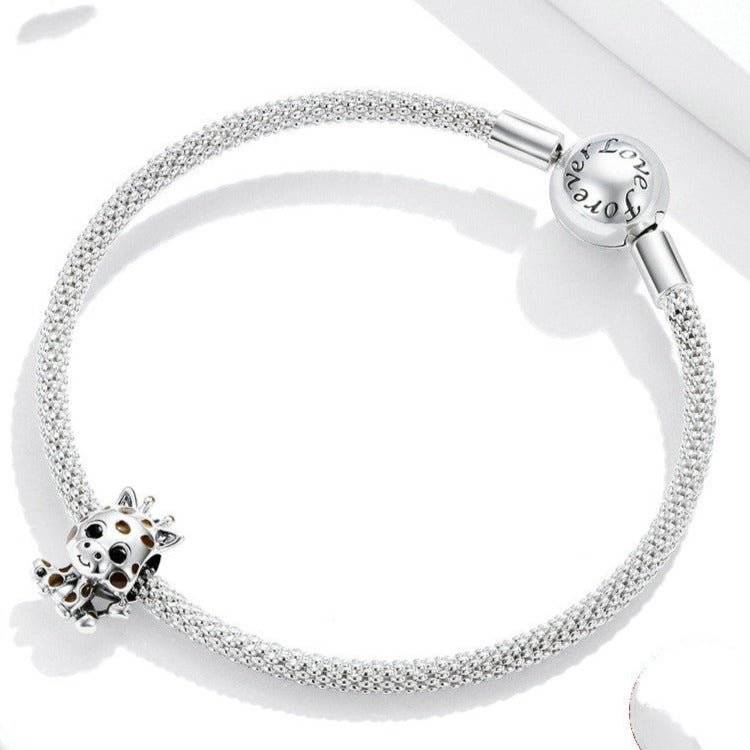 Adorable Baby Giraffe Charm on silver mesh bracelet, ideal for animal lovers. Cute giraffe design adds charm to any jewelry collection.