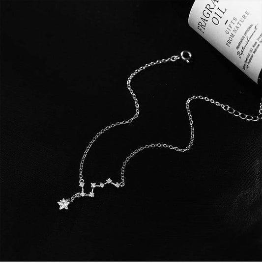 Close-up of Shining Star Anklet with star-shaped pendants on a fine silver chain, perfect accessory for celestial-inspired fashion lovers.