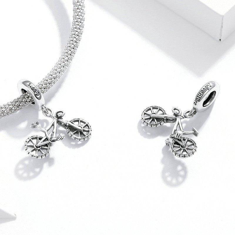 Adventure Bike Charm in silver, featuring a detailed bicycle design, ideal for bracelets of cycling lovers and free spirits. Adds a sporty, stylish touch.