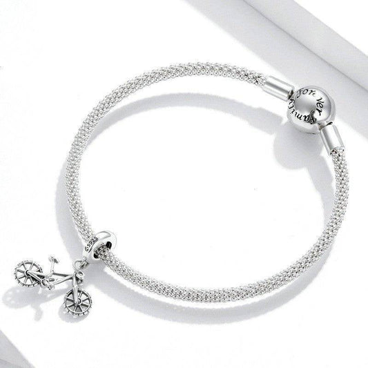 Adventure Bike Charm on silver mesh bracelet, ideal for cyclists and free spirits. Adds a stylish, adventurous touch to any jewelry collection.