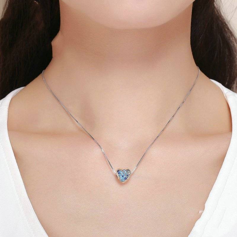 Blue Butterfly Charm - Embrace Freedom & Beauty 🦋💙 necklace featuring a delicate silver chain and a detailed blue butterfly pendant, worn on a woman's neck.