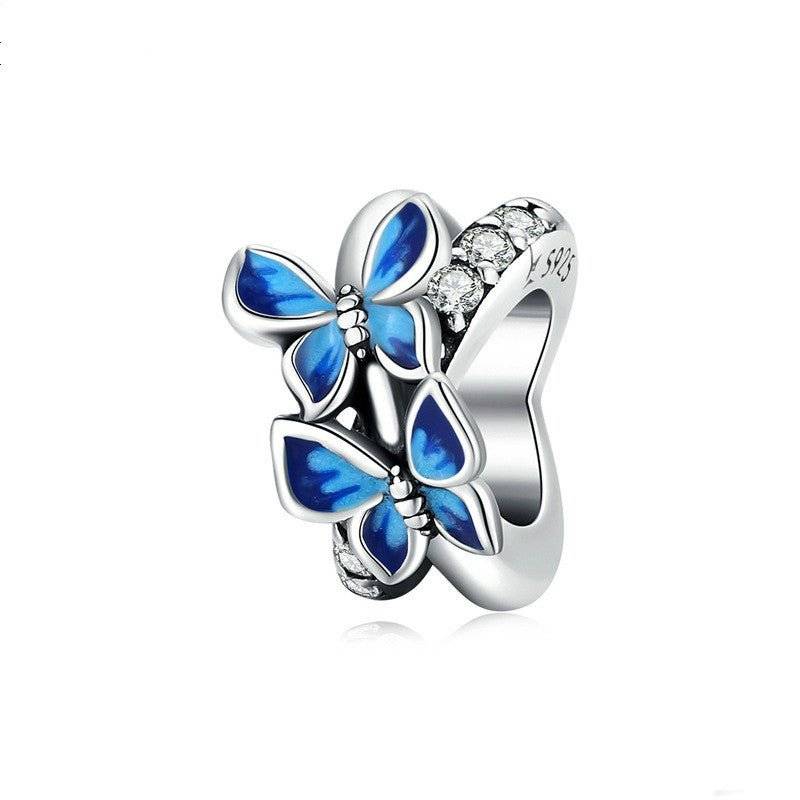 Charming Butterfly Spacer featuring vibrant blue enamel butterflies and sparkling crystal accents, perfect for enhancing bracelet elegance.
