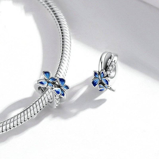 Charming Butterfly Spacer in silver with blue enamel wings and crystal accents, perfect for enhancing bracelet elegance in jewelry collections.