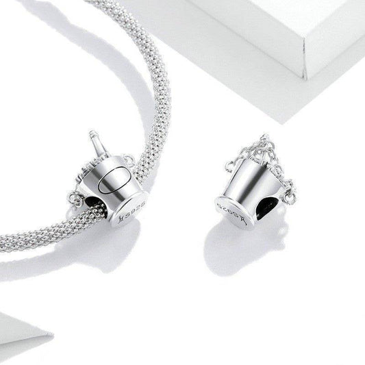 Stylish Champagne Bucket Charm attached to a silver mesh bracelet, perfect for celebrating special occasions in style.