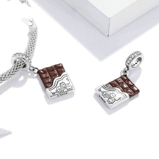 Delicious Chocolate Charm featuring a silver and brown chocolate bar design with engraved cartoon characters. Ideal for dessert-themed bracelets.