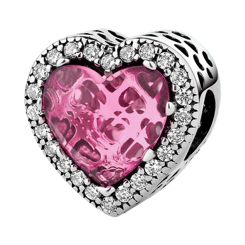 Glass Heart Charm - Elegant Love Symbol for Your Bracelet featuring a pink textured heart center with sparkling crystal accents in silver setting.
