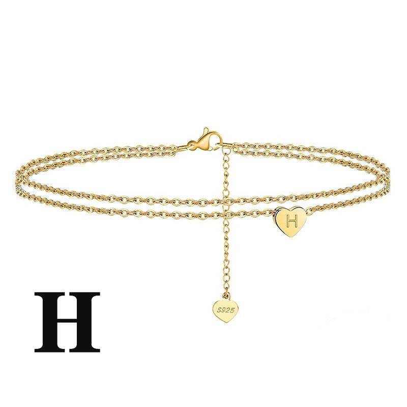 Personalized Letter Heart Anklet with 'H' charm. Double-chain gold anklet perfect for gifting or daily wear.