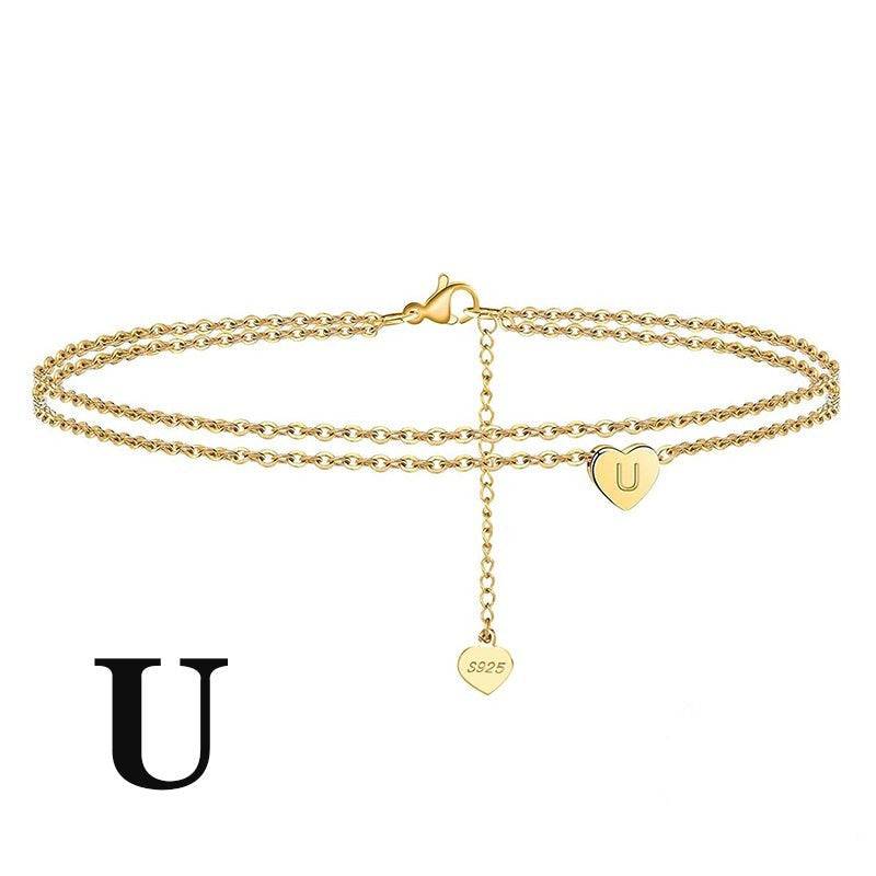 Custom Letter Heart Anklet with 'U' charm. Made from 925 sterling silver with gold plating for a luxe look.