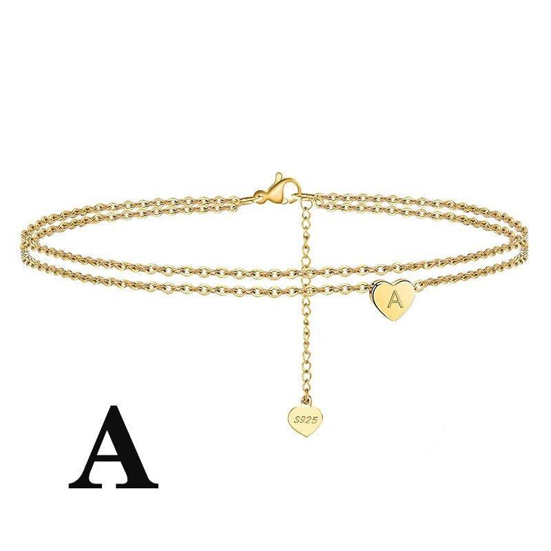 Letter Heart Anklet with engraved 'A' charm in gold-plated 925 sterling silver. Stylish double-chain design for personalized fashion.