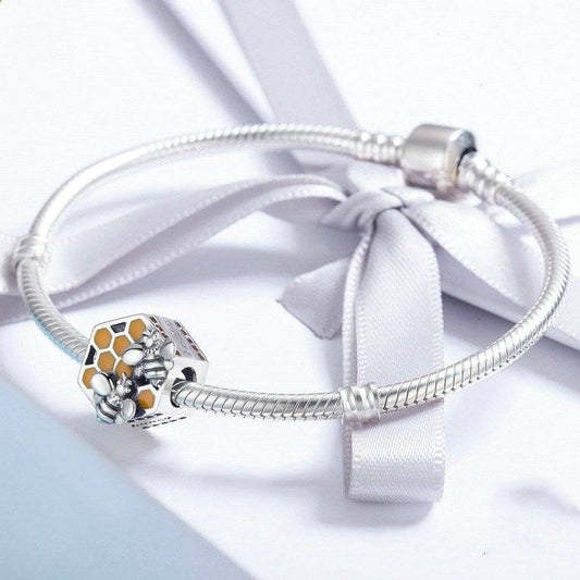 Honeycomb Charm - Celebrate Nature’s Sweet Design 🍯🐝 shown on a silver bracelet, highlighting its elegant bee and honeycomb design for charm collectors.