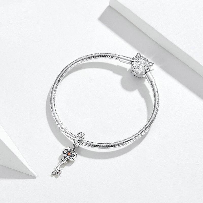 Elegant Key Charm - Unlock New Possibilities 🔑✨ featuring a silver key-shaped pendant on a sleek bracelet, ideal for charm collectors and jewelry lovers.