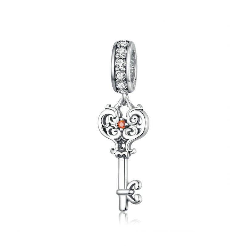 Elegant Key Charm with intricate silver detailing and sparkling crystals, perfect for bracelets. Symbolizes new beginnings and opportunity.