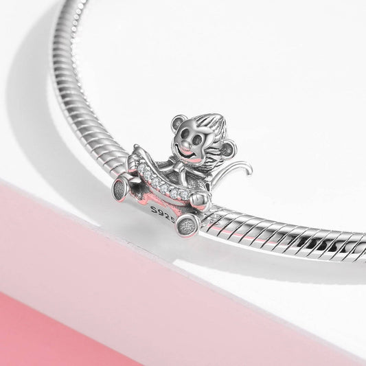 Playful Monkey Charm in sterling silver with sparkling accents, designed to add fun and character to your bracelet. Ideal for charm collectors.