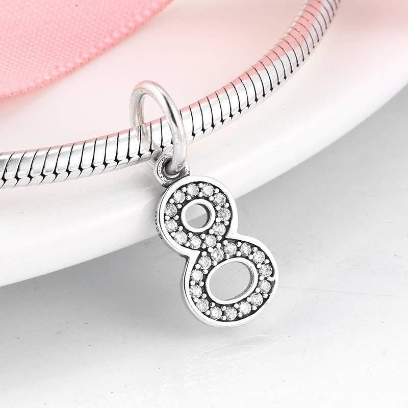 Silver number 8 charm encrusted with rhinestones, perfect for unique charm bracelets. Number Charm - Customised Style for Any Occasion ✨