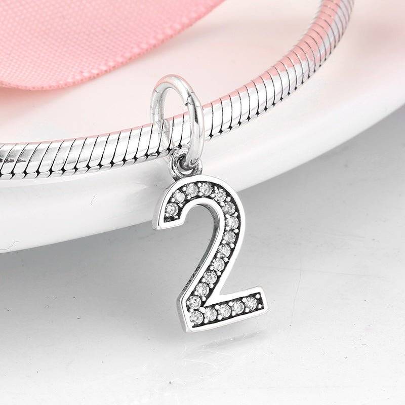 Elegant silver number 2 charm with rhinestone accents for unique jewelry. Number Charm - Customised Style for Any Occasion ✨