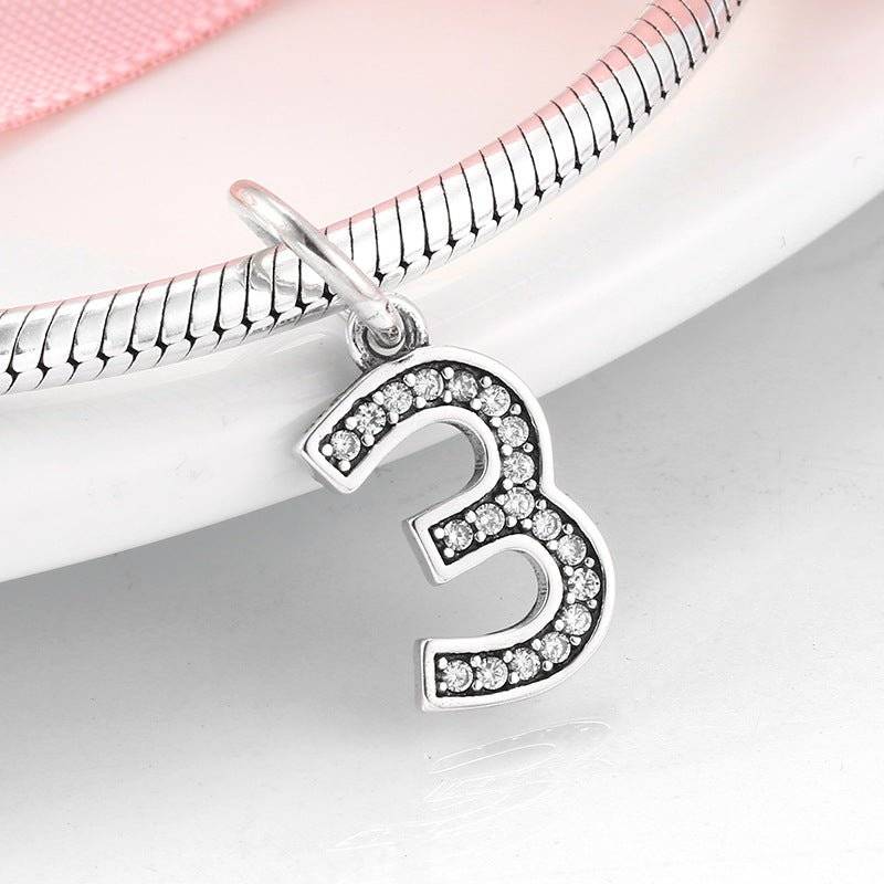 Stylish silver number 3 charm featuring sparkling rhinestones. Number Charm - Customised Style for Any Occasion ✨