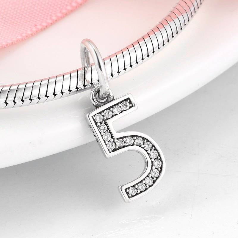 Chic silver number 5 charm adorned with rhinestones for personalized accessories. Number Charm - Customised Style for Any Occasion ✨