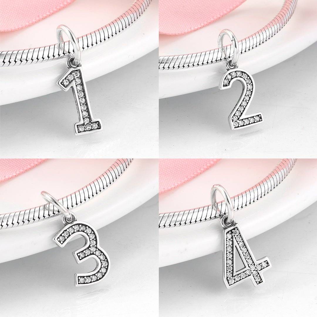 Set of silver number charms 1 to 4 with rhinestone detailing, perfect for custom bracelets. Number Charm - Customised Style for Any Occasion ✨