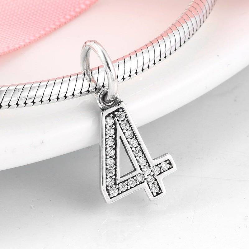 Silver number 4 charm with shimmering rhinestones, perfect for charm bracelets. Number Charm - Customised Style for Any Occasion ✨