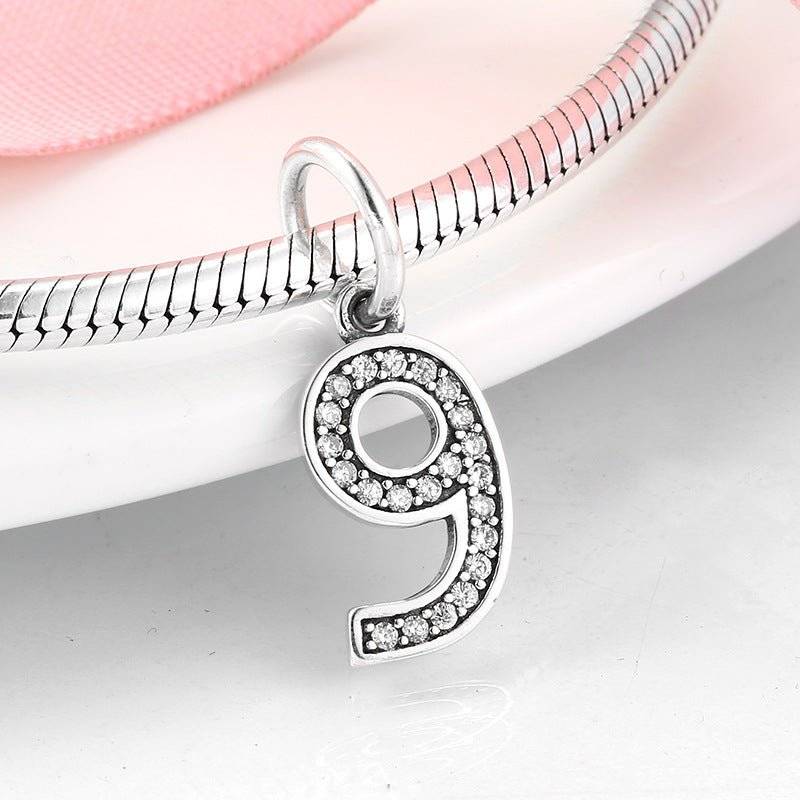 Sparkling silver number 9 charm with rhinestones for personalized jewelry. Number Charm - Customised Style for Any Occasion ✨