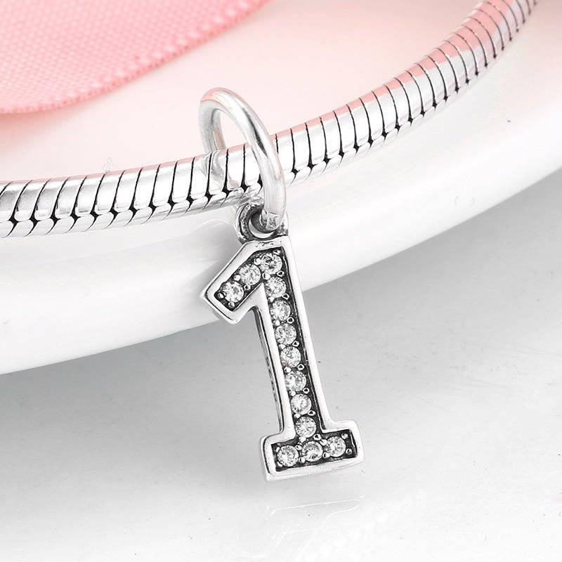 Silver number 1 charm with embedded rhinestones, great for custom bracelets. Number Charm - Customised Style for Any Occasion ✨