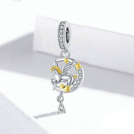 Enchanting Pegasus Charm featuring a silver flying horse with gold accents and starry crescent moon, ideal for fantasy-themed jewelry collections.