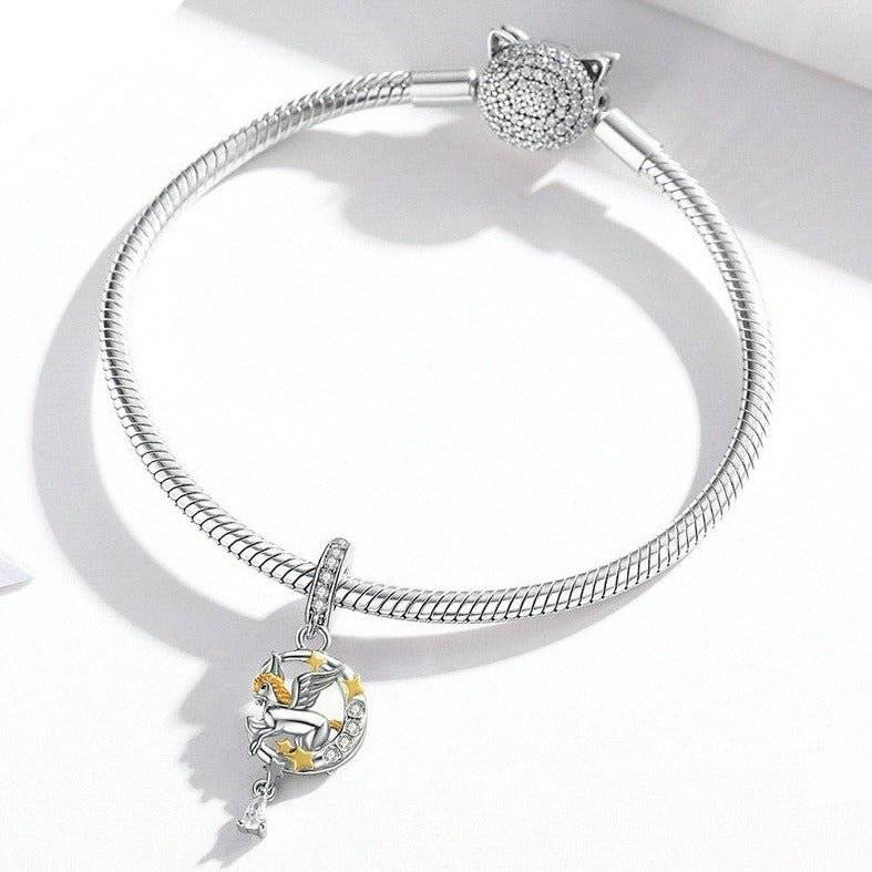 Enchanting Pegasus Charm on silver bracelet with moon and star accents, perfect for fantasy lovers in jewelry charms & pendants category.