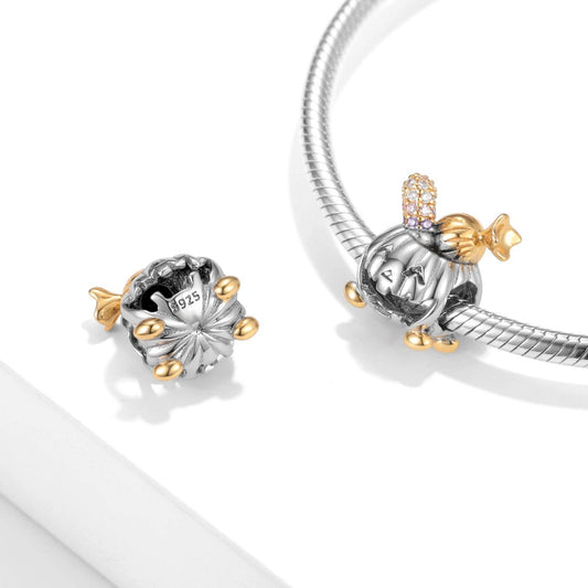 Charming Pumpkin Charm in silver and gold tones with crystal accents, ideal for autumn and Halloween-themed bracelets.