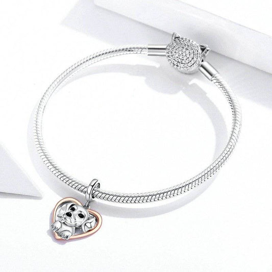 Puppy Charm - Celebrate Your Furry Friend’s Love 🐶💖 featuring a silver puppy inside a rose gold heart on a sleek snake chain bracelet. Ideal for pet lovers.