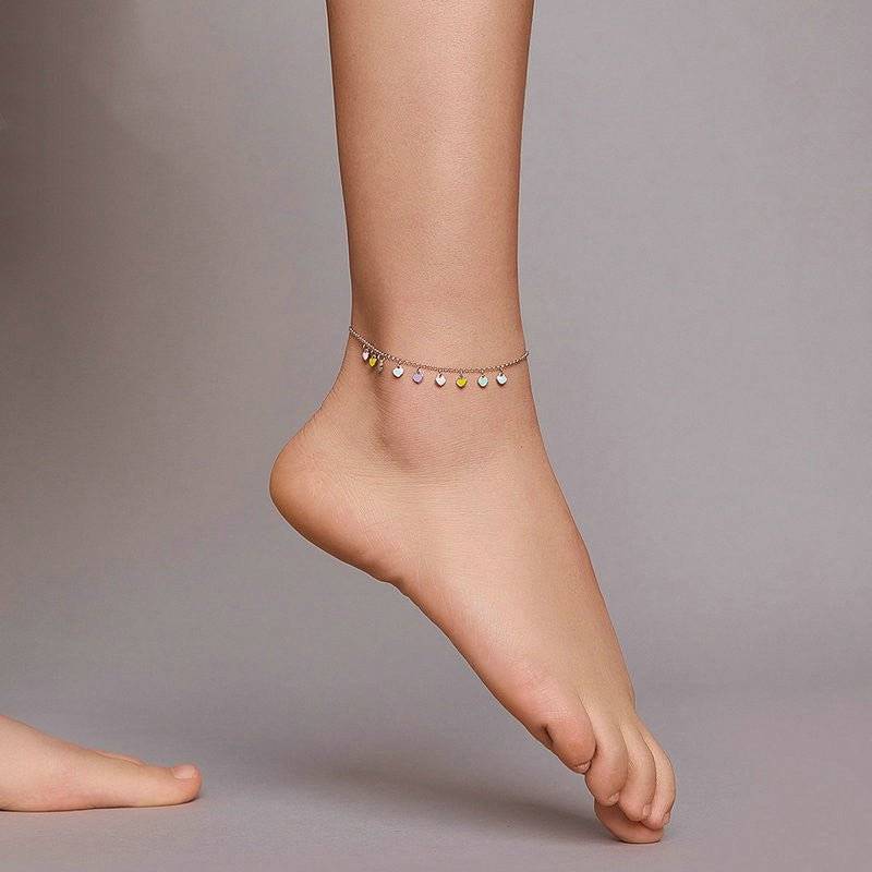 Rainbow Heart Anklet worn on ankle, showcasing its playful and stylish design with colourful heart charms for a trendy accessory look.