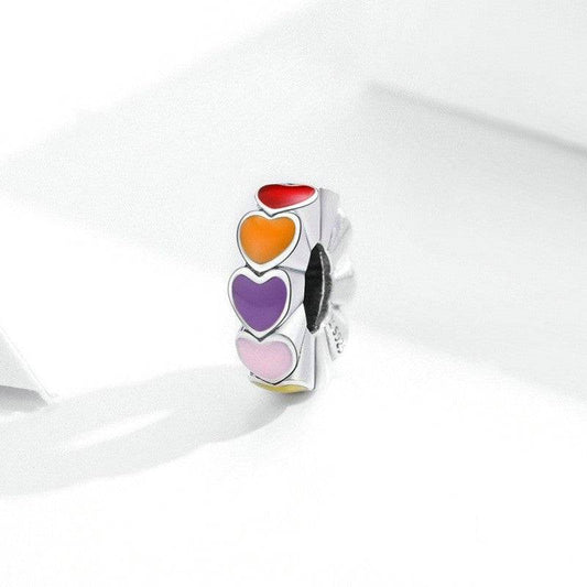 Vibrant Rainbow Heart Spacer charm featuring red, orange, pink, and purple enamel hearts on a silver base. Ideal for colorful bracelet styling.