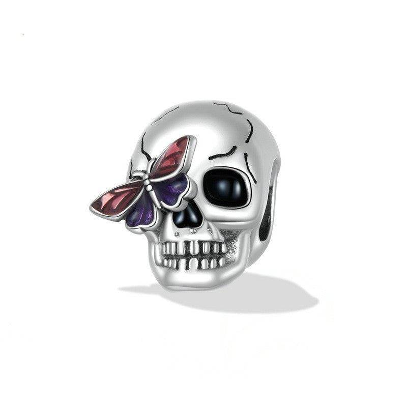 Stylish Retro Skull Charm for Bracelets featuring a silver skull with a purple and red butterfly on the eye, perfect for vintage jewelry lovers.