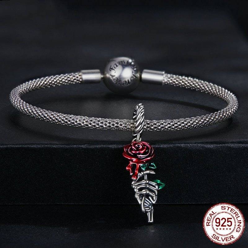 Elegant Scarlet Rose Charm for Bracelets attached to a silver bracelet, showcasing its vivid red rose design and premium sterling silver quality.