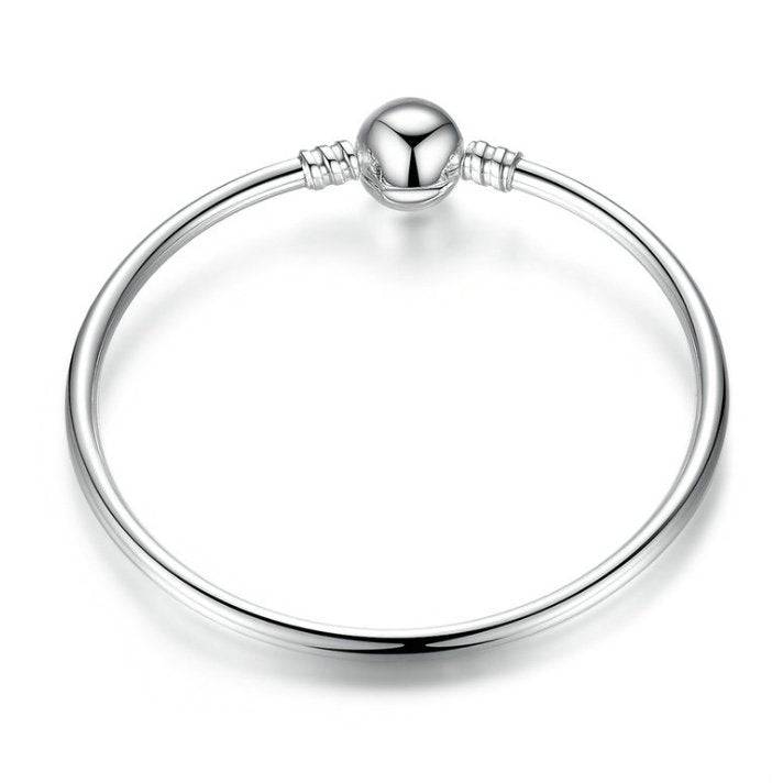 Elegant Silver Bangle Bracelet with polished round clasp, perfect for timeless style in any jewelry collection. Ideal for casual or formal wear.