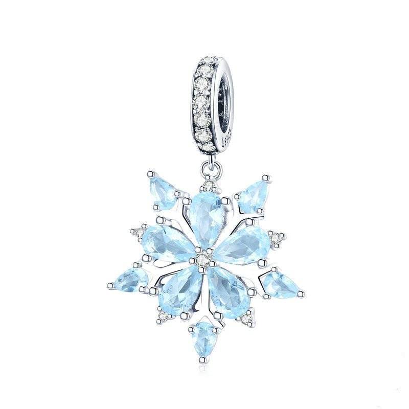 Elegant snowflake charm with blue gemstones