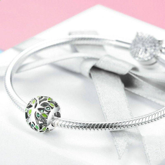 Tree of Life Charm - Embrace Growth & Connection 🌳💚 featuring green enamel leaves on a silver charm, shown on a snake chain bracelet. Ideal for symbolic jewelry lovers.