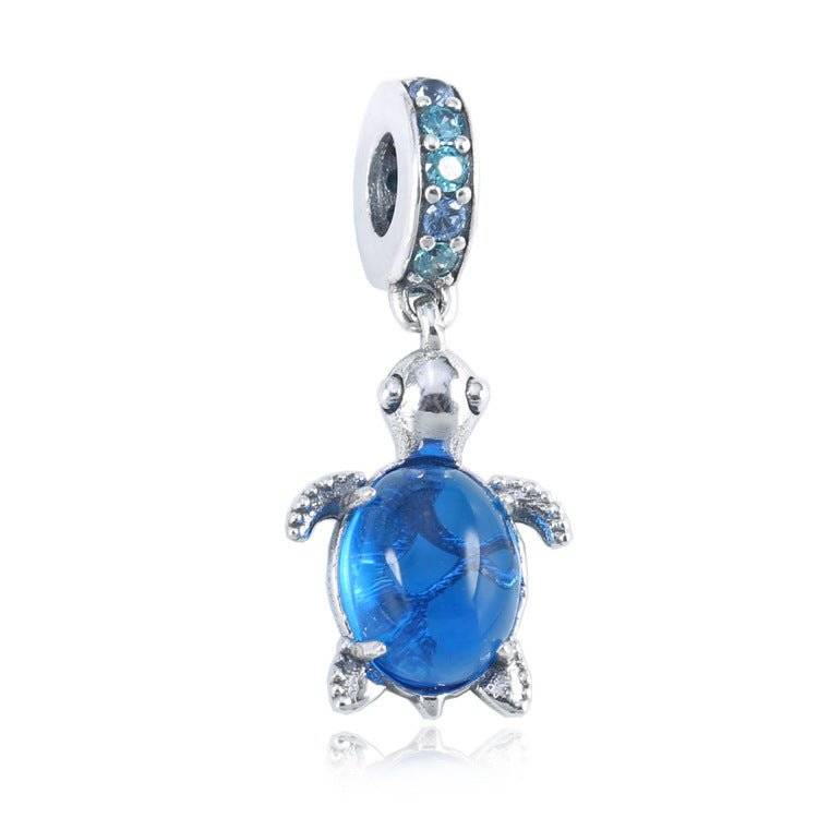 Charming Turtle Charm featuring a blue crystal shell and silver detailing, symbolizing wisdom and resilience for bracelets or necklaces.
