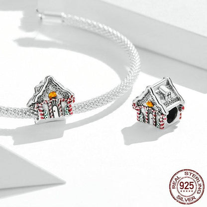 Christmas House Charm in sterling silver with red, green, and yellow enamel accents. Festive winter cottage design for holiday charm collections.