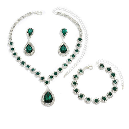 Three-piece Jewellery Set - Complete Set | Elegant Trio in green with necklace, earrings, and bracelet featuring teardrop and floral crystal design.