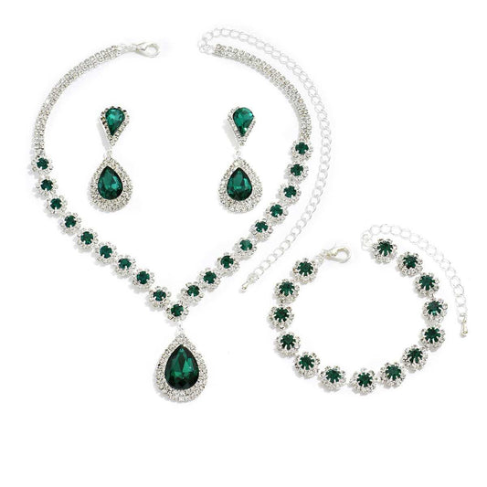 Three-piece Jewellery Set - Complete Set | Elegant Trio in green with necklace, earrings, and bracelet featuring teardrop and floral crystal design.