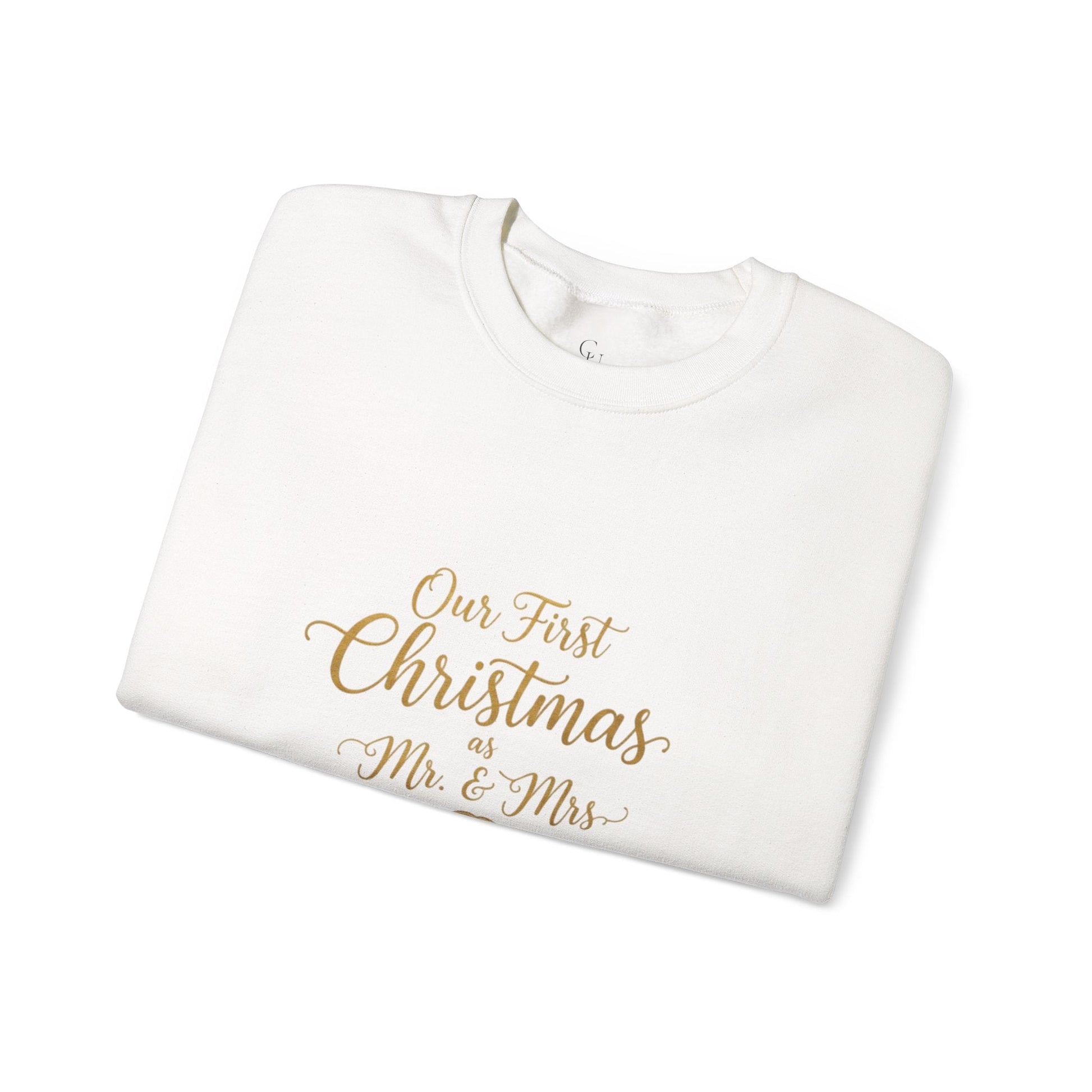 His/Hers Newlyweds Sweatshirt folded in white with gold script reading 'Our First Christmas as Mr. & Mrs.' Ideal holiday apparel for couples.
