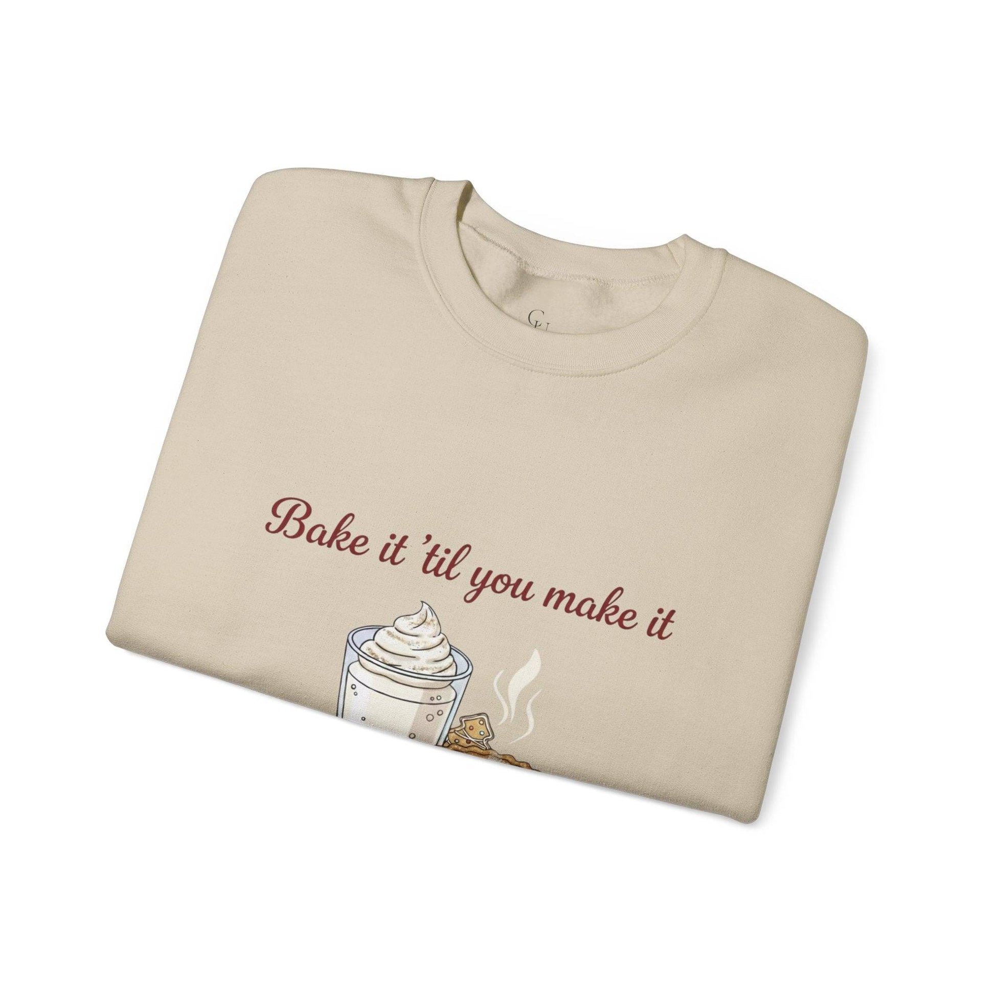 Women’s Sweatshirt - “Bake it ‘til you make it” folded beige crewneck with embroidered whipped cream and cookie design, ideal for cozy wine lovers.