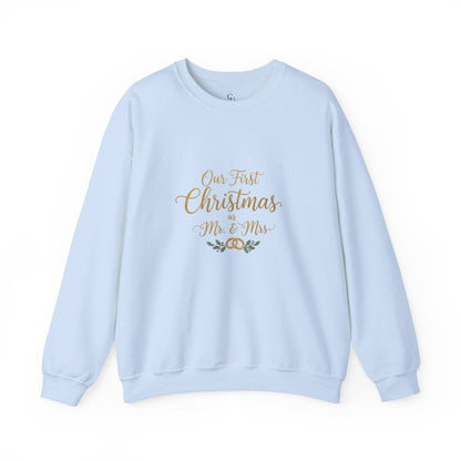 His/Hers Newlyweds Sweatshirt in light blue with 'Our First Christmas as Mr. & Mrs.' gold embroidery. Cozy unisex crewneck for holiday gifting.