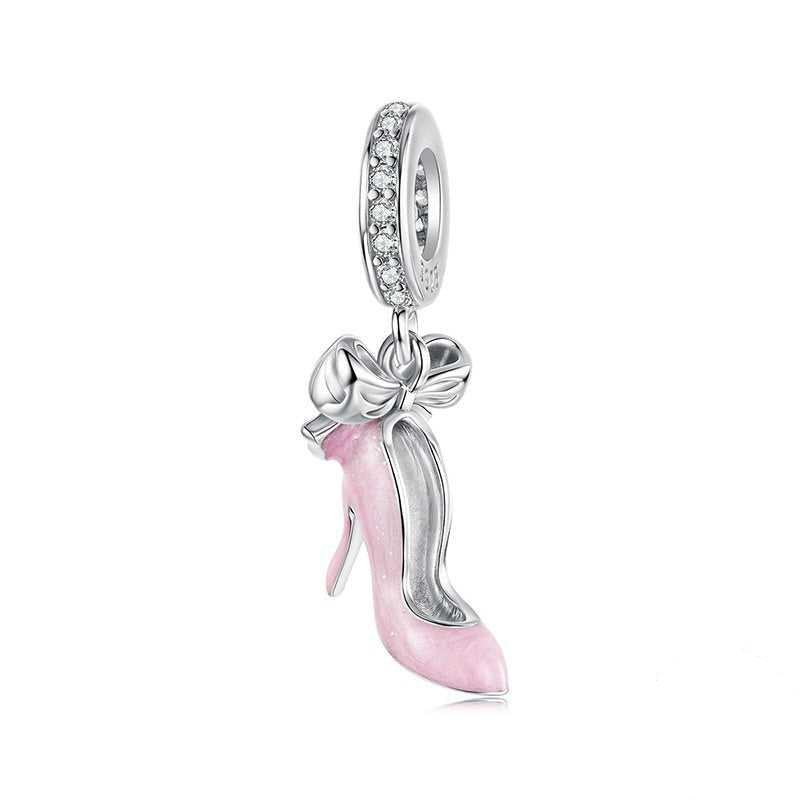 Silver and pink high-heeled shoe charm with bow on a white background