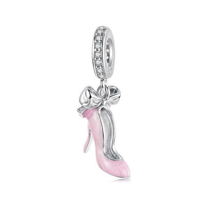Silver and pink high-heeled shoe charm with bow on a white background