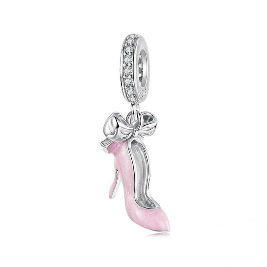Silver and pink high-heeled shoe charm with bow on a white background