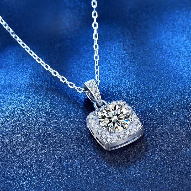 Close-up of square pendant moissanite necklace with a silver chain, emphasizing the intricate details of the design.