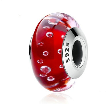 Red glass bubble charm with bubble pattern